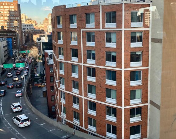 Extremes: A Roosevelt Island View of Real Estate Affordable housing rises along the Tram's path.